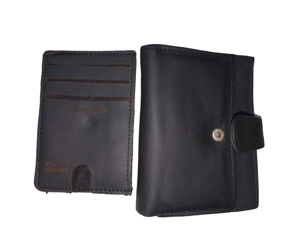 Two black leather wallets on a textured surface